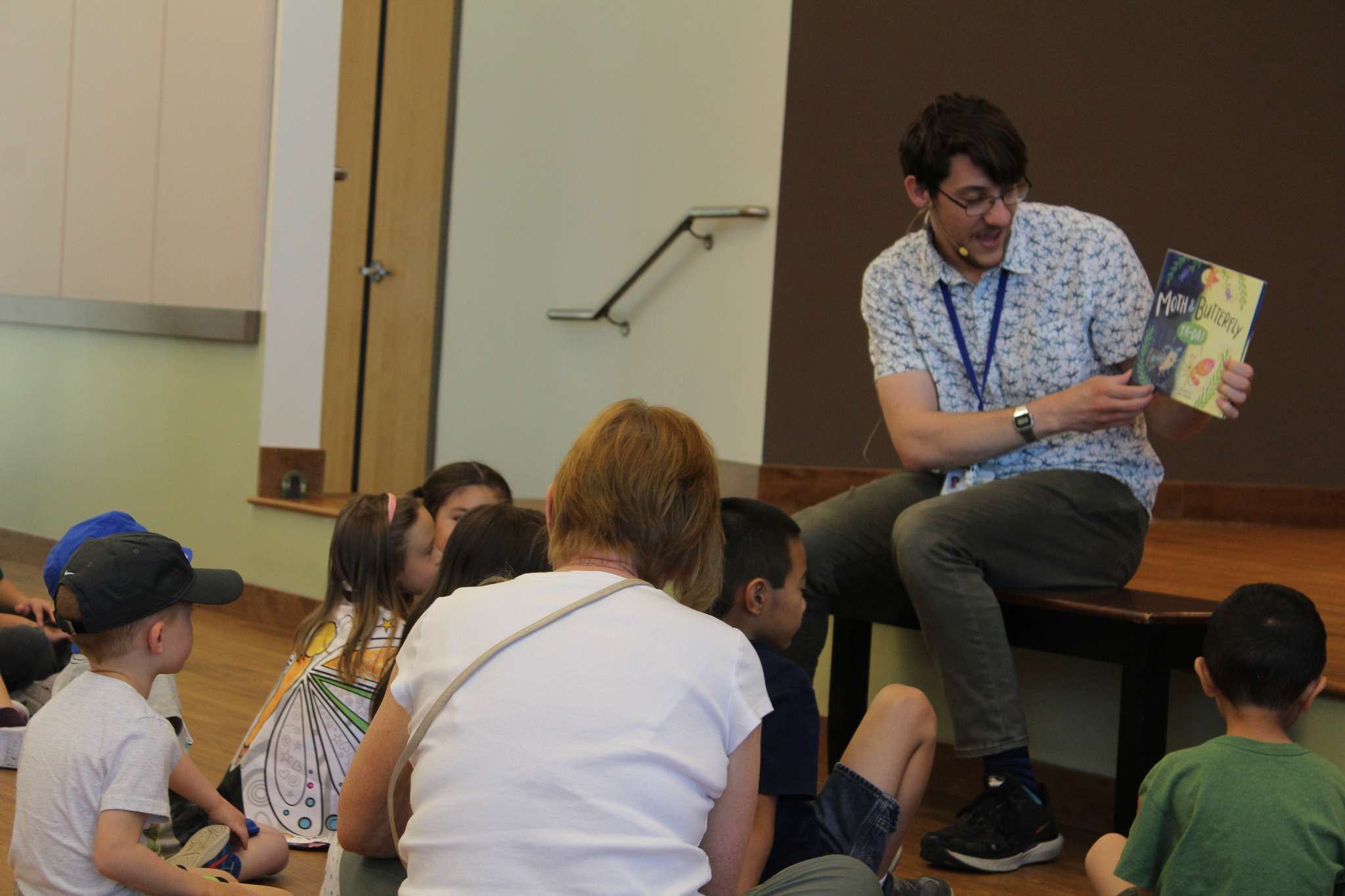 Mark reading a story to children.