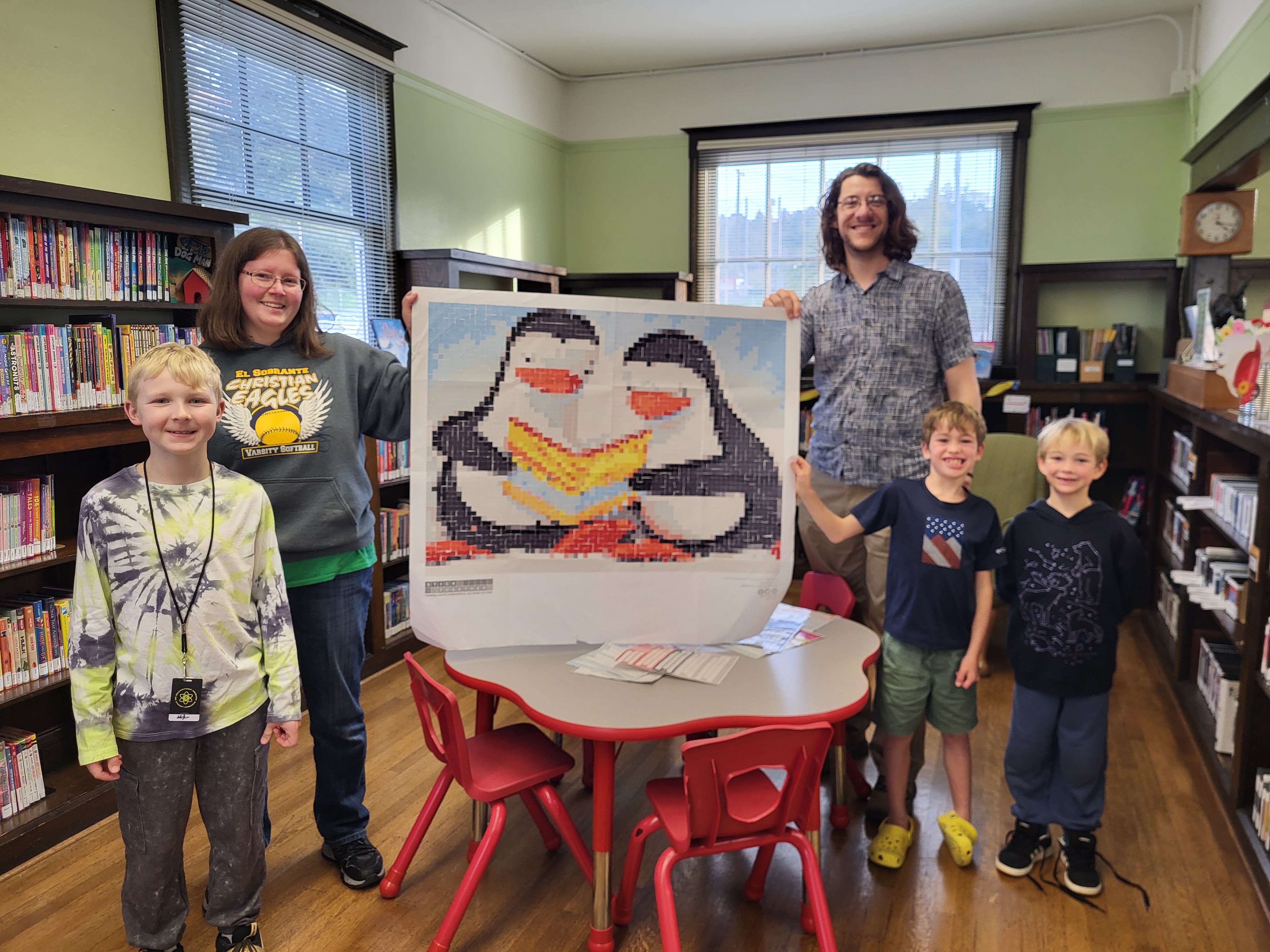Mark with a completed sticker puzzle with library patrons.